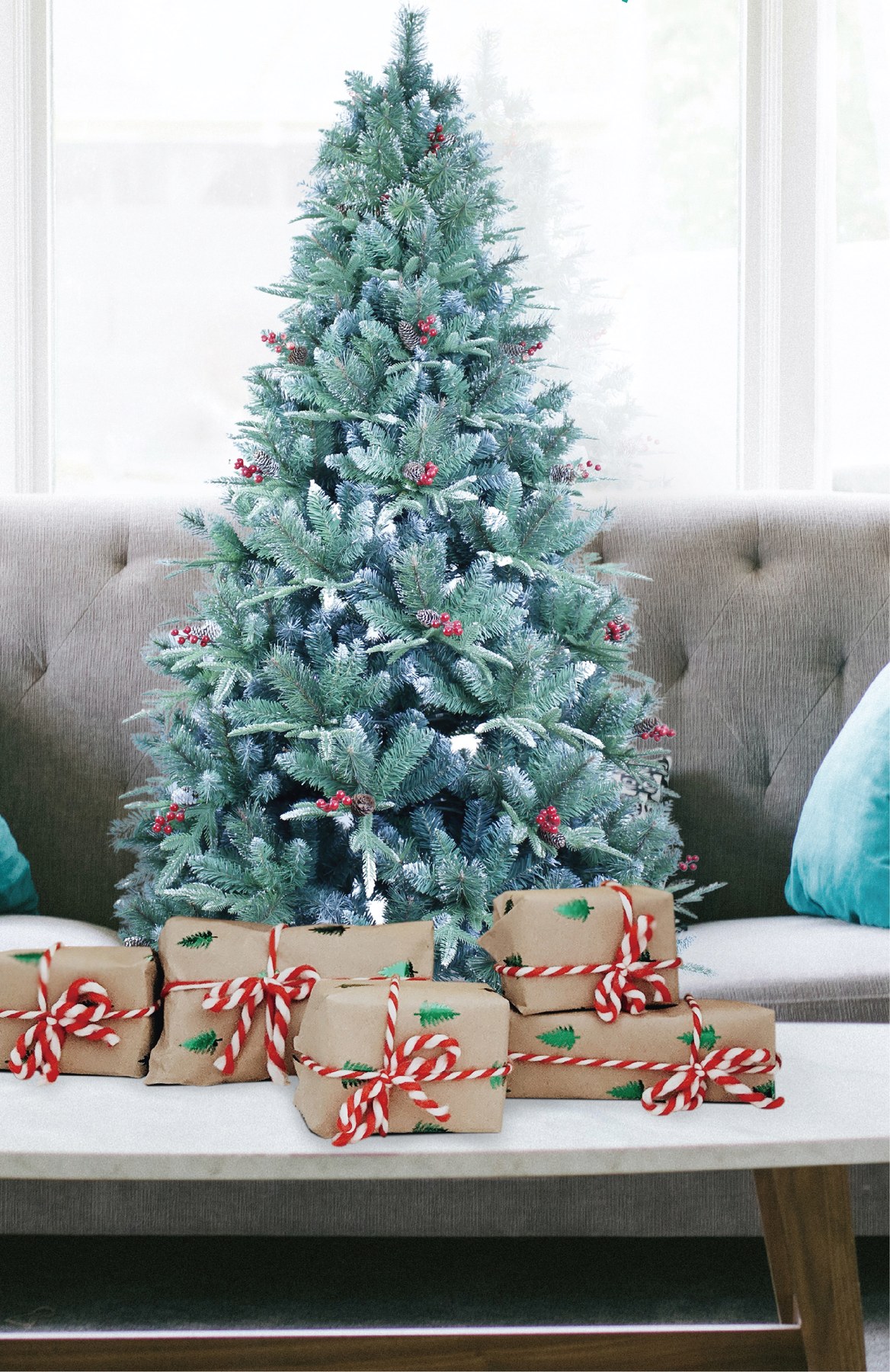 Flocked artificial Christmas tree with red berries